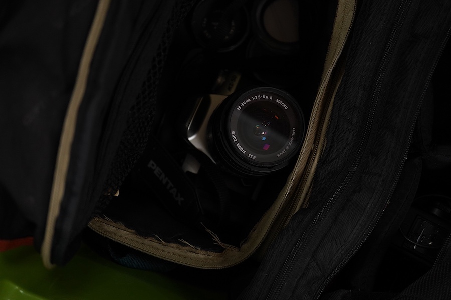 Eight SLR and DSLR camera bodies by Nikon, Zenit-E, Fujifilm, Canon, etc., together with thirteen lenses, a boxed Rollei A110 and other accessories including camera cases, etc. Condition - poor to fair.